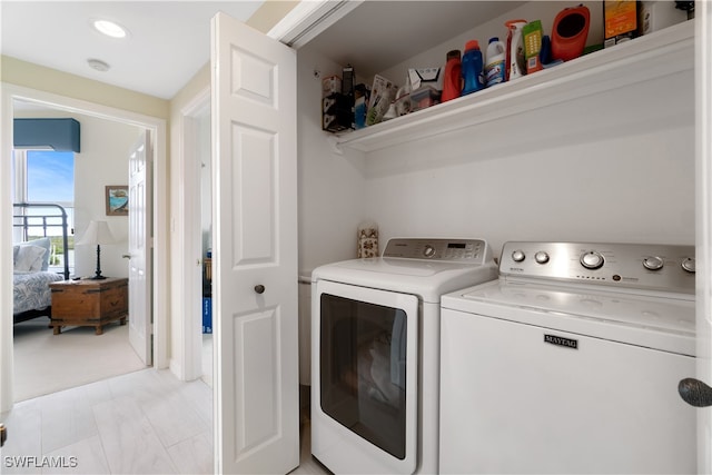 laundry area with independent washer and dryer