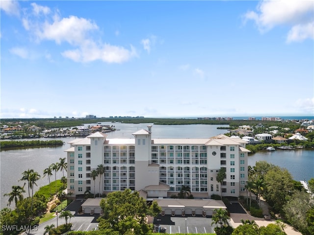 birds eye view of property with a water view