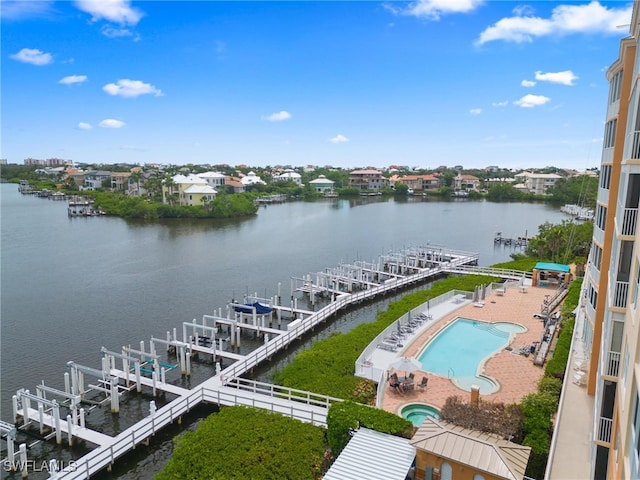 birds eye view of property featuring a water view