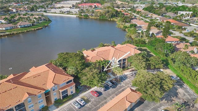 drone / aerial view with a water view