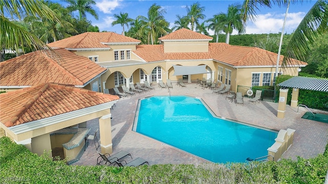 view of swimming pool with a patio area