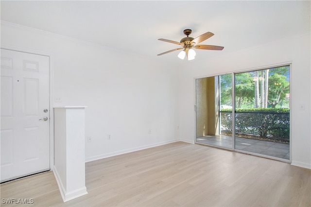 empty room featuring crown molding, ceiling fan, and light hardwood / wood-style flooring