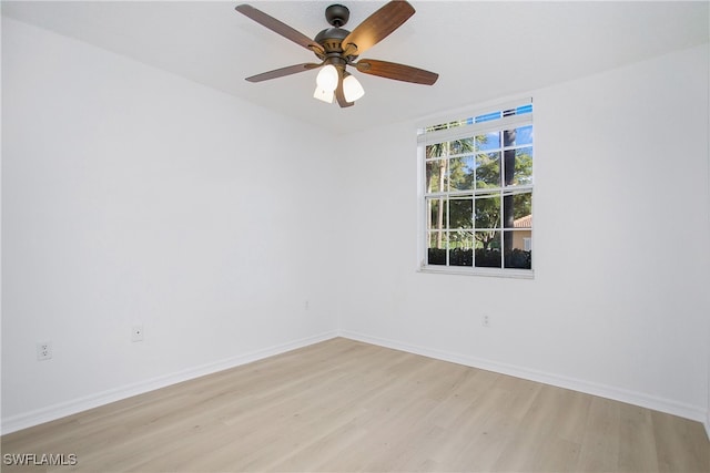 empty room featuring ceiling fan and light hardwood / wood-style floors