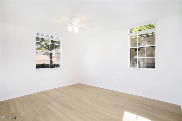 spare room with ceiling fan and light hardwood / wood-style floors