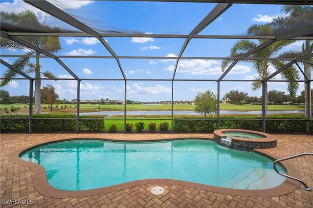 view of pool featuring an in ground hot tub, a water view, and glass enclosure