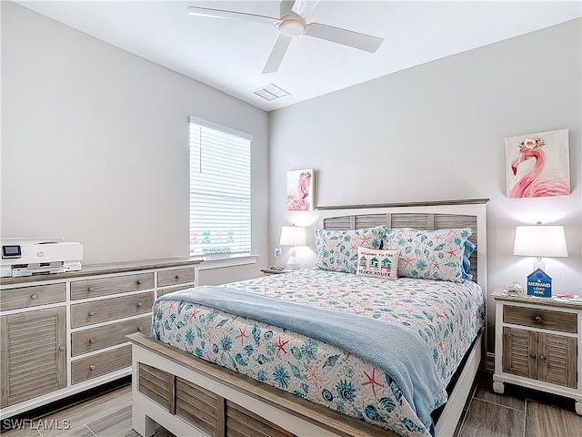 bedroom featuring ceiling fan and wood-type flooring