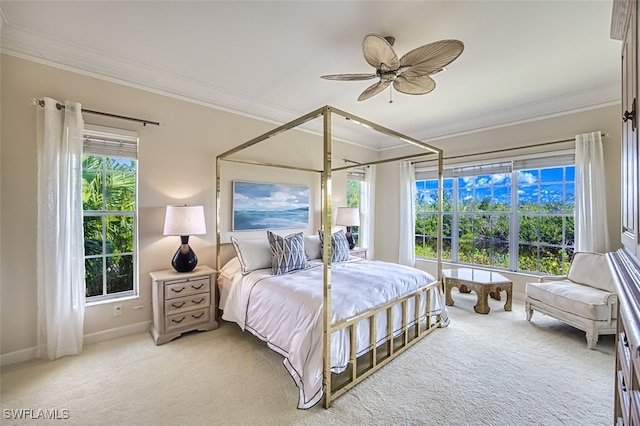 bedroom with multiple windows, carpet, ornamental molding, and ceiling fan