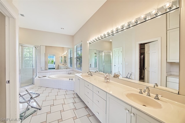 bathroom featuring plus walk in shower and vanity