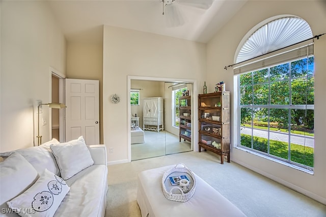 living room with light carpet and a wealth of natural light