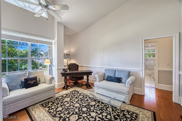 living room featuring high vaulted ceiling, ceiling fan, and hardwood / wood-style floors