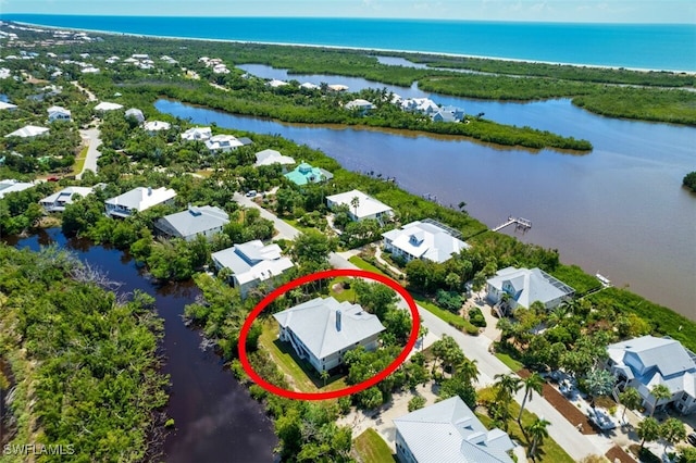 birds eye view of property with a water view