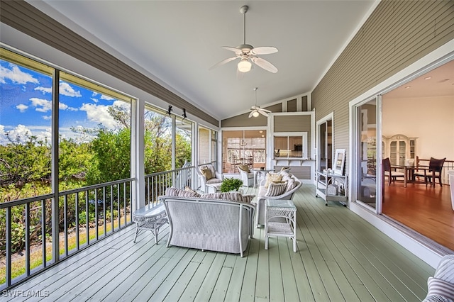 sunroom / solarium featuring vaulted ceiling and ceiling fan