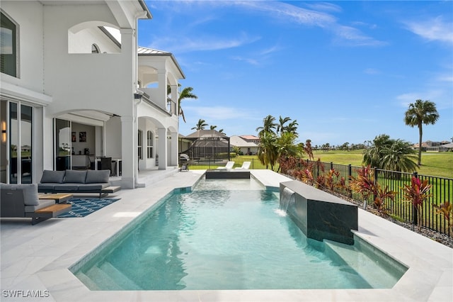 view of swimming pool with a patio area, outdoor lounge area, pool water feature, and a hot tub