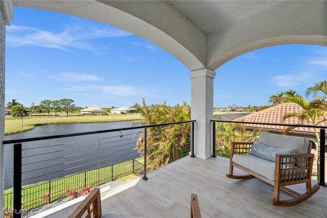 balcony featuring a water view