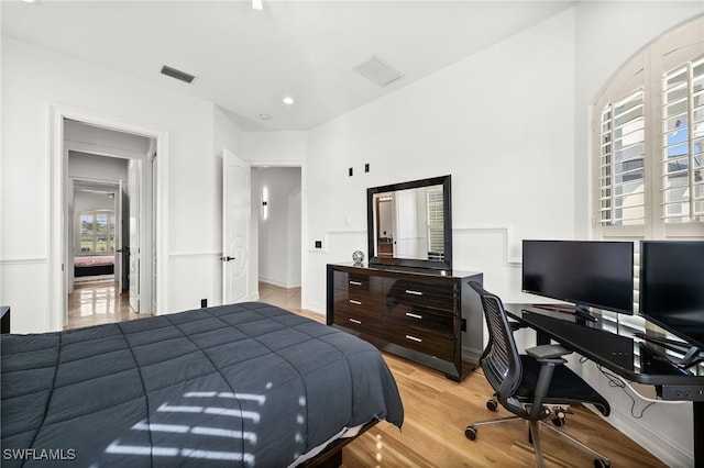 bedroom with light wood-type flooring