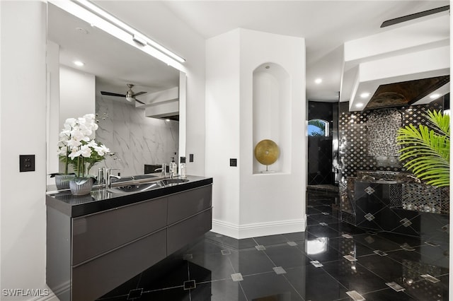 bathroom featuring vanity, ceiling fan, and a shower