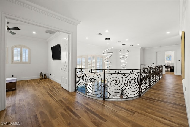 hallway with crown molding and wood-type flooring