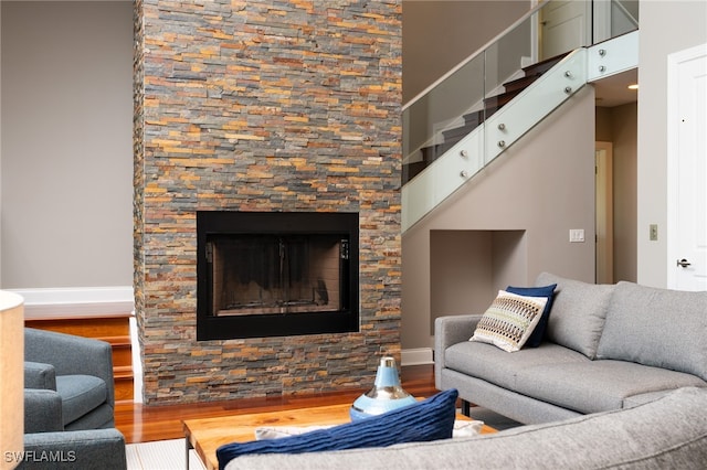 living room with hardwood / wood-style floors and a fireplace