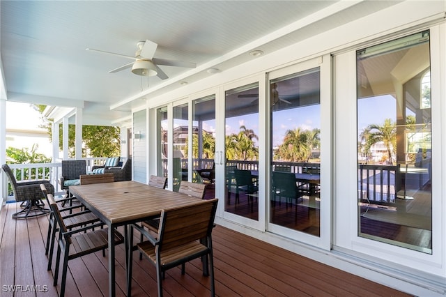 wooden deck featuring ceiling fan