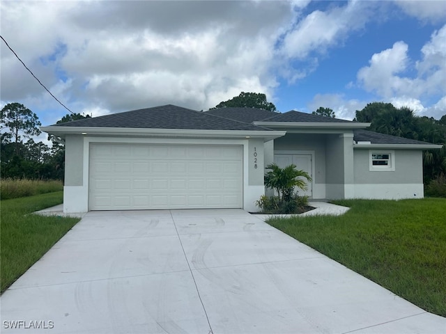 single story home featuring a front yard and a garage