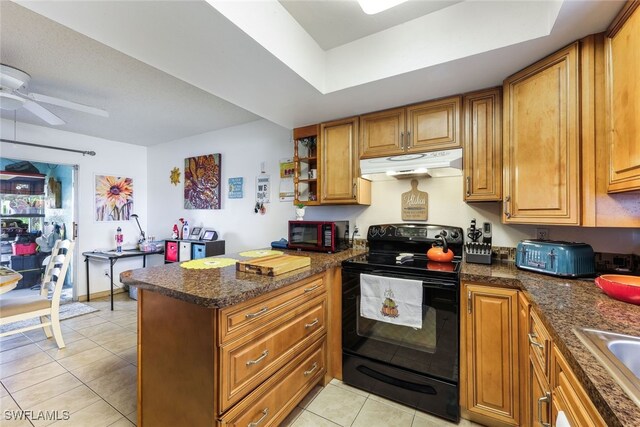 kitchen featuring black appliances, kitchen peninsula, light tile patterned flooring, and ceiling fan