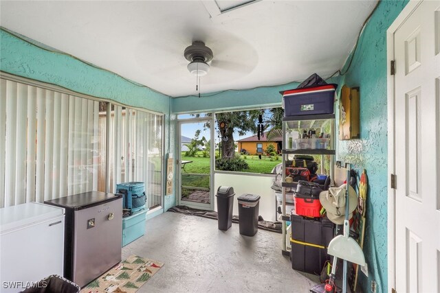 interior space with concrete floors and ceiling fan