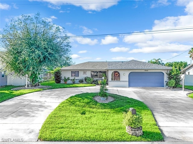 single story home with a garage and a front lawn