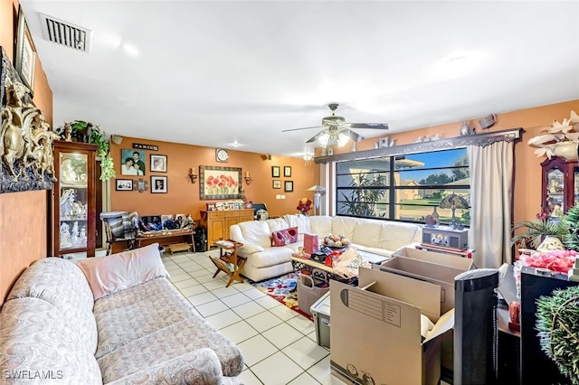 living room with ceiling fan and light tile patterned floors