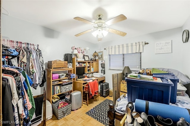 interior space with light parquet flooring and ceiling fan