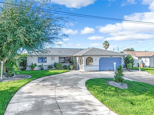 ranch-style house featuring a front lawn and a garage