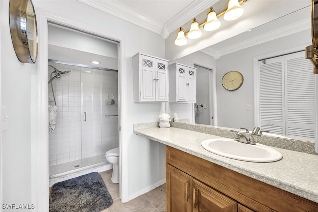 bathroom featuring toilet, ornamental molding, a shower with shower door, vanity, and tile patterned floors