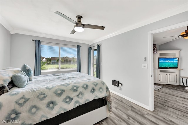 bedroom with a ceiling fan, baseboards, crown molding, and light wood finished floors