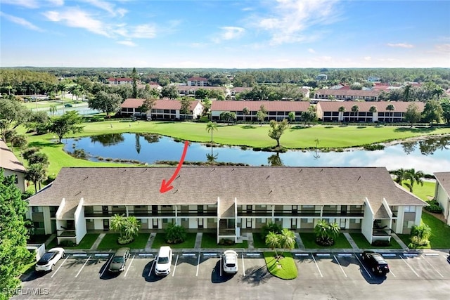 birds eye view of property with a water view