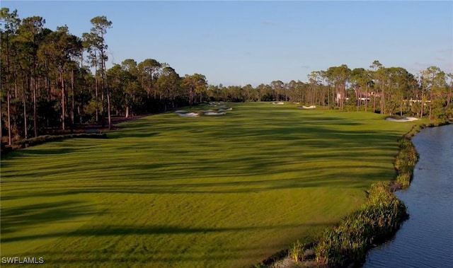 15183 Brolio Way, Naples, FL 34110 - view of community featuring golf course view, a water view, and view of wooded area