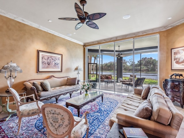 living room with ornamental molding and ceiling fan