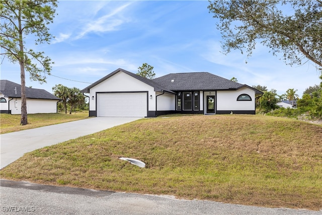 view of front of house featuring a front yard and a garage