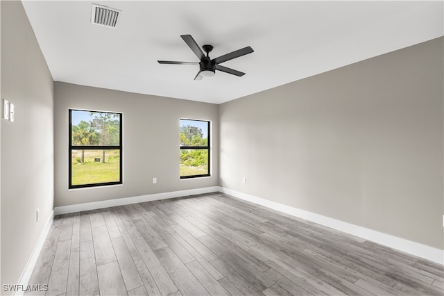 spare room with ceiling fan and light hardwood / wood-style flooring