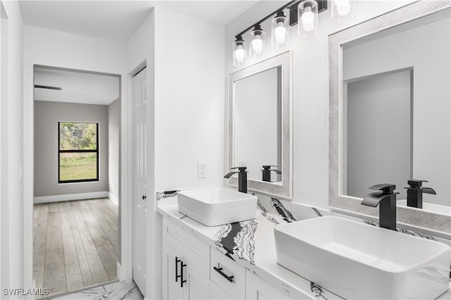 bathroom with vanity and hardwood / wood-style flooring