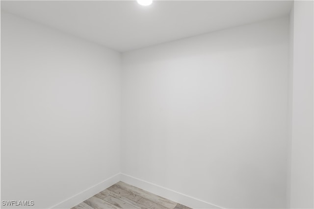 empty room with light hardwood / wood-style flooring