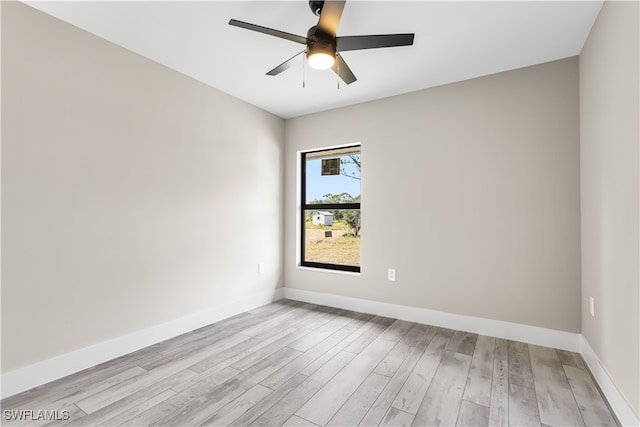 unfurnished room with ceiling fan and light wood-type flooring