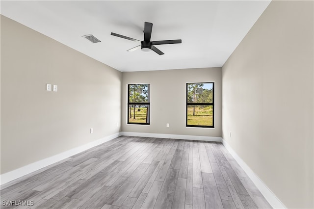 spare room with ceiling fan and light hardwood / wood-style flooring