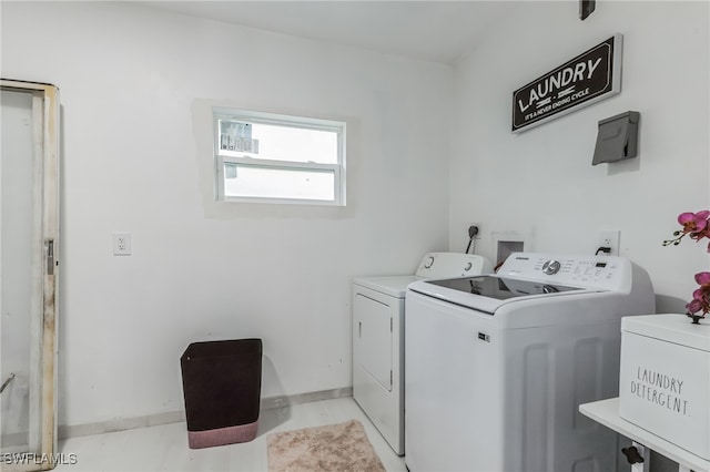 laundry area featuring washing machine and clothes dryer