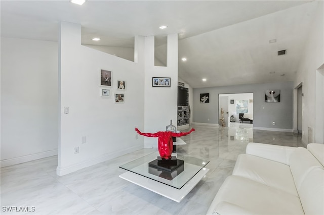 living room with vaulted ceiling