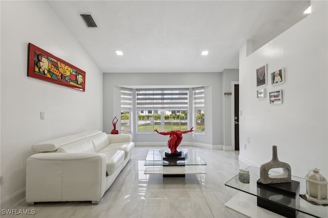 living room with vaulted ceiling