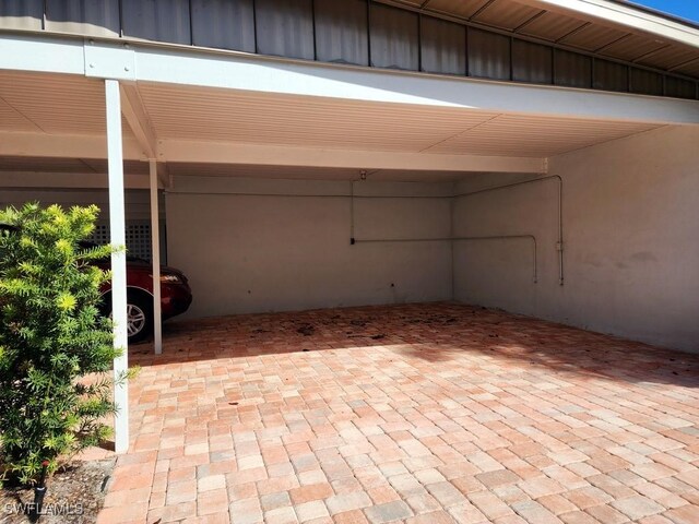 exterior space with a carport