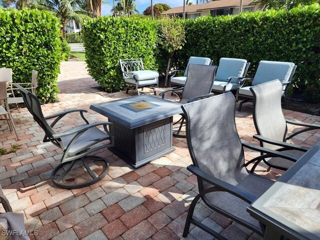 view of patio featuring a fire pit