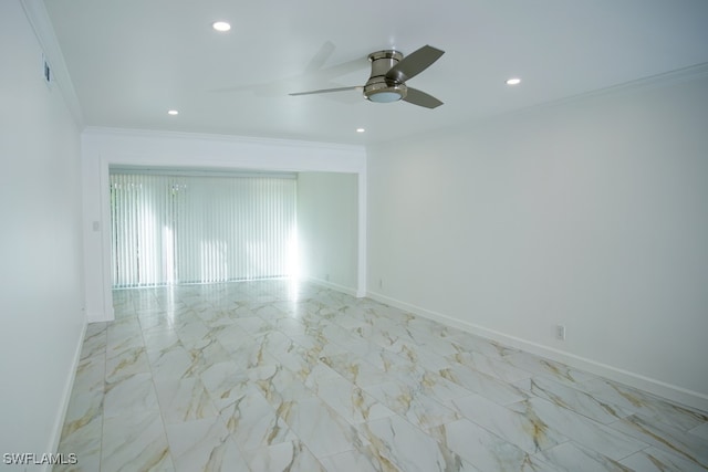 unfurnished room featuring crown molding, a ceiling fan, baseboards, and marble finish floor