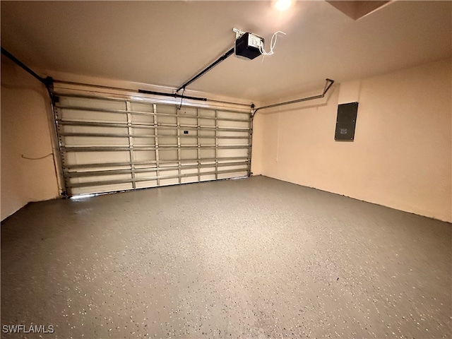 garage featuring a garage door opener and electric panel