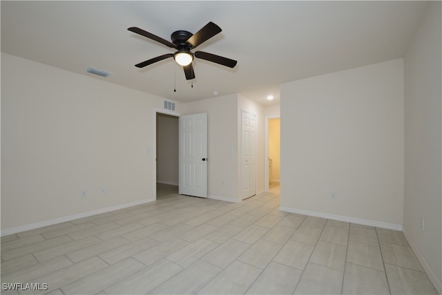 spare room with ceiling fan