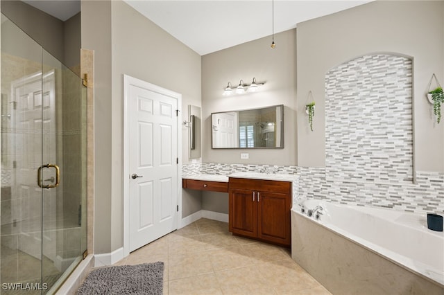 bathroom featuring vanity, independent shower and bath, backsplash, and tile patterned floors